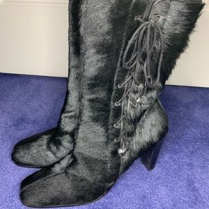 Black 3/4 length boot. Real cow skin,only worn once
